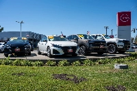 New Nissan vehicles at a dealership in Concord, California | BLOOMBERG