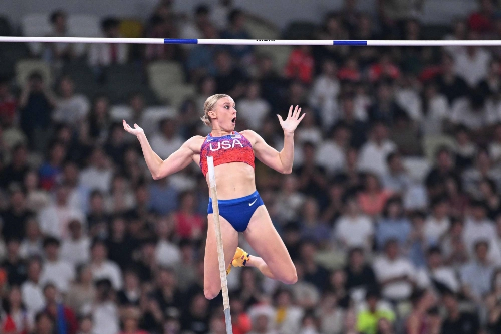 Katie Moon competes in the women's pole vault final during the World Athletics Championships at Tokyo's National Stadium on Wednesday. The American won the gold medal.  Katie Moon competes in the women's pole vault final during the World Athletics Championships at Tokyo's National Stadium on Wednesday. The American won the gold medal.