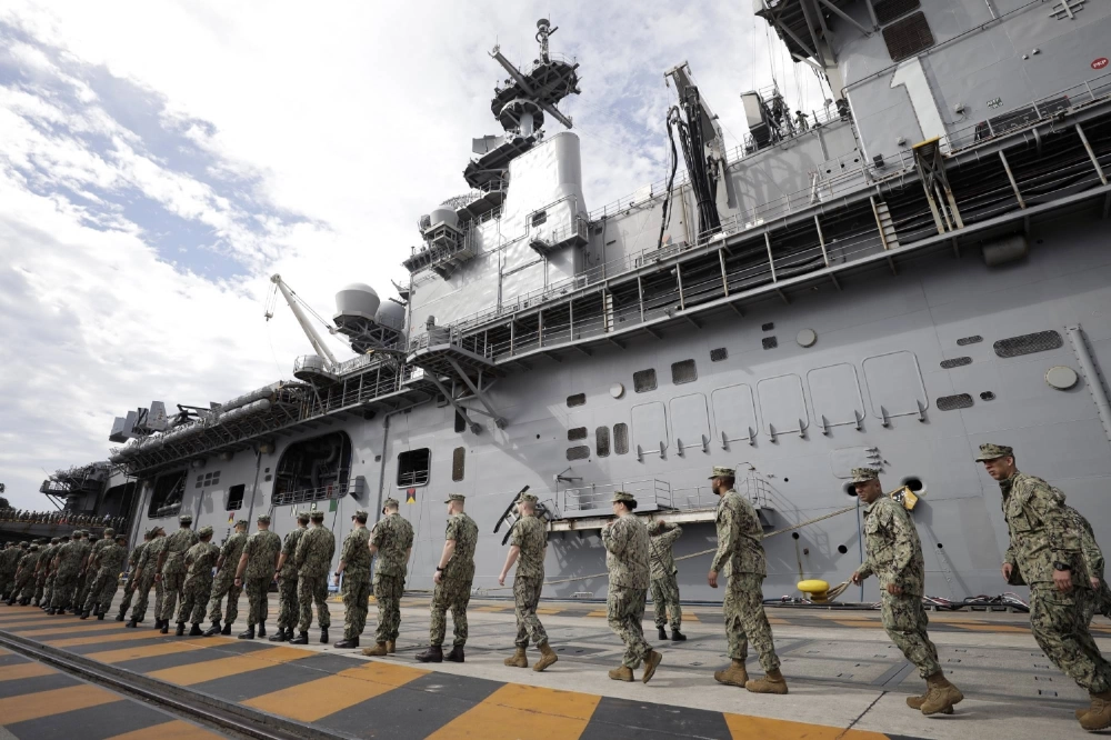 U.S. military personnel board the USS Wasp aircraft carrier at the U.S. naval base in Yokosuka, Kanagawa Prefecture, in 2019. U.S. military personnel board the USS Wasp aircraft carrier at the U.S. naval base in Yokosuka, Kanagawa Prefecture, in 2019.