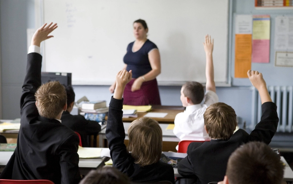 Pupils put their hands up to answer a question during a lesson at a grammar school in Maidstone, U.K. Private school alumni remain dominant among the most powerful positions in British society despite corporate efforts to hire from more diverse backgrounds. Pupils put their hands up to answer a question during a lesson at a grammar school in Maidstone, U.K. Private school alumni remain dominant among the most powerful positions in British society despite corporate efforts to hire from more diverse backgrounds.
