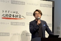 Takaya Awata, president of Toridoll Holdings, speaks at a news conference in Tokyo on Wednesday. | JIJI
