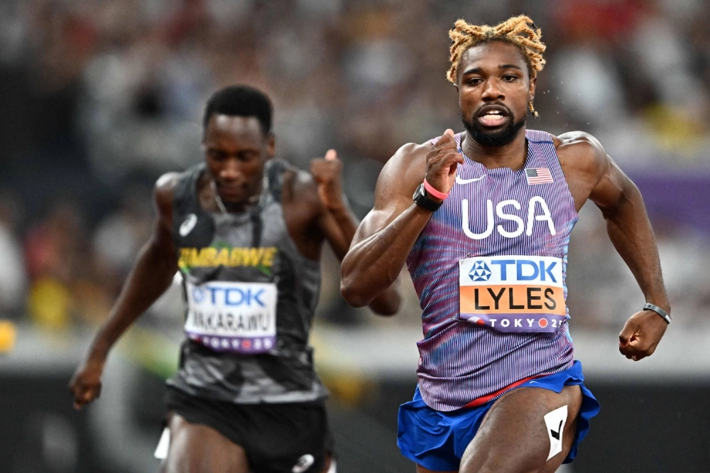 American Noah Lyles competes in the men's 200-meter semifinals at the World Athletics Championships at Tokyo's National Stadium on Thursday. American Noah Lyles competes in the men's 200-meter semifinals at the World Athletics Championships at Tokyo's National Stadium on Thursday.