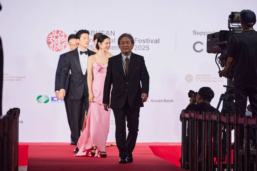 Park Chan-wook (center) attended the Busan International Film Festival opening ceremony with “No Other Choice" cast members on Wednesday. Park Chan-wook (center) attended the Busan International Film Festival opening ceremony with “No Other Choice" cast members on Wednesday.