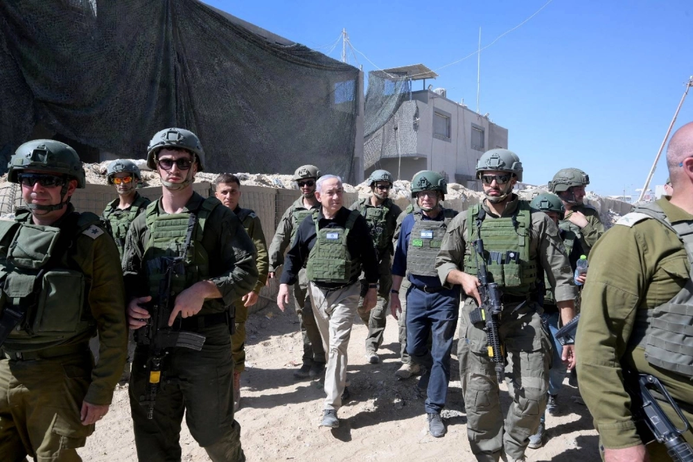Israeli Prime Minister Benjamin Netanyahu visits Israeli soldiers carrying out operations in Rafah, in the southern Gaza, in July 2024.  Israeli Prime Minister Benjamin Netanyahu visits Israeli soldiers carrying out operations in Rafah, in the southern Gaza, in July 2024.