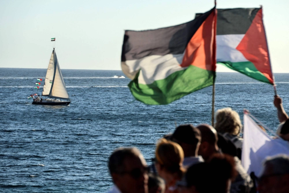 Activists wave Palestinian flags as they gather to support a flotilla carrying humanitarian aid in Ajaccio, on the French Mediterranean island of Corsica, on Sept 12. Activists wave Palestinian flags as they gather to support a flotilla carrying humanitarian aid in Ajaccio, on the French Mediterranean island of Corsica, on Sept 12.