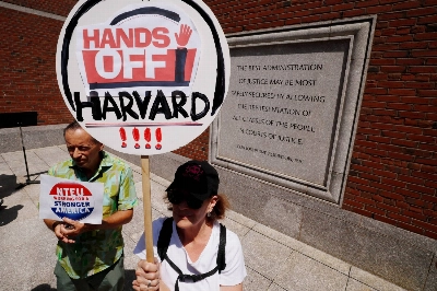 Demonstrators gather in Boston in July to support Harvard University’s fight against the Trump administration’s attempt to cut federal research funding. Demonstrators gather in Boston in July to support Harvard University’s fight against the Trump administration’s attempt to cut federal research funding.