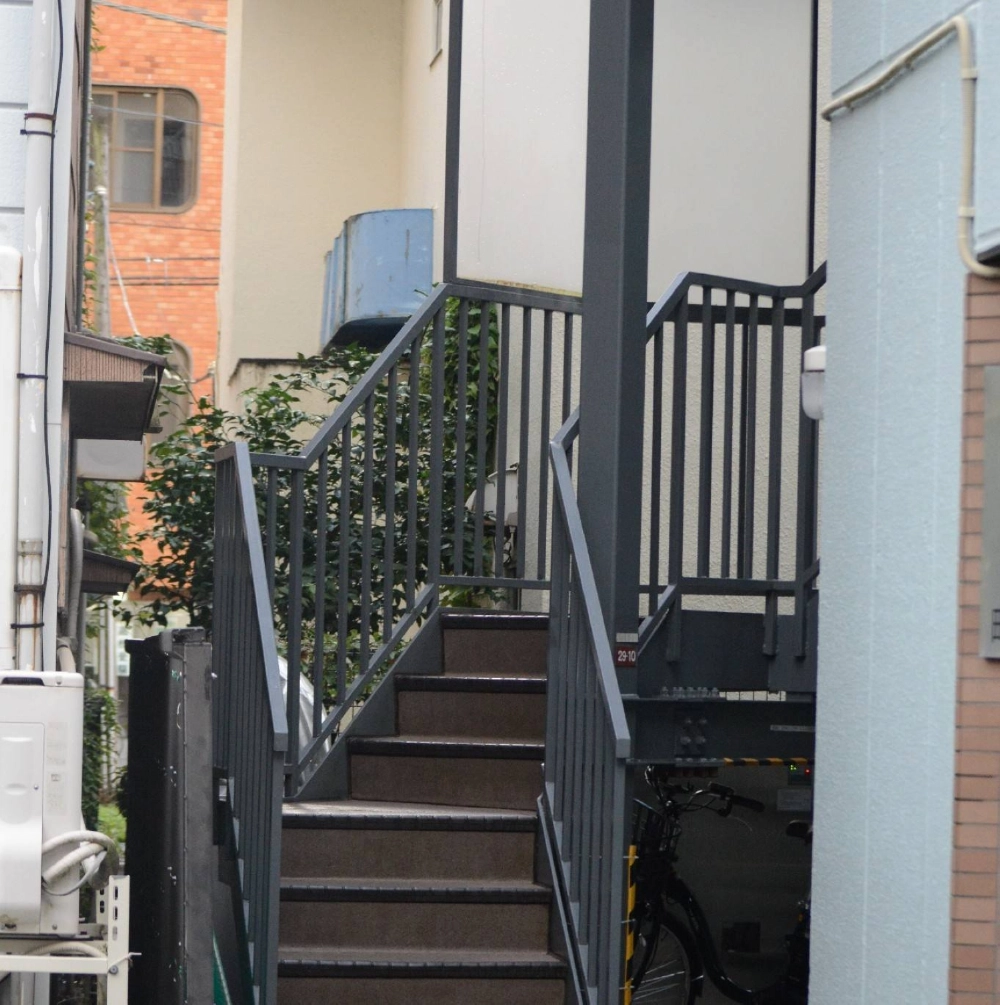 An exterior staircase at the apartment building where Chizuko Akie was fatally stabbed, in the city of Machida, Tokyo, on Wednesday An exterior staircase at the apartment building where Chizuko Akie was fatally stabbed, in the city of Machida, Tokyo, on Wednesday