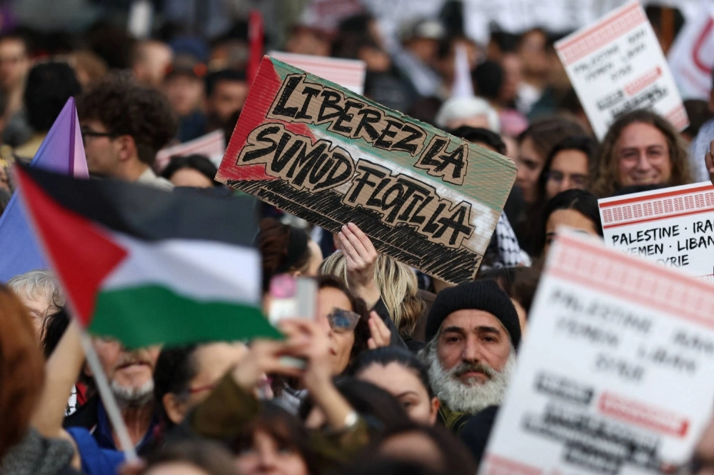 A protester holds a placard that reads "Free the Sumud Flotilla" during a protest to condemn Israel's interception of the vessels of the Global Sumud Flotilla, at the Place de la Republique in Paris, on Thursday. A protester holds a placard that reads "Free the Sumud Flotilla" during a protest to condemn Israel's interception of the vessels of the Global Sumud Flotilla, at the Place de la Republique in Paris, on Thursday.