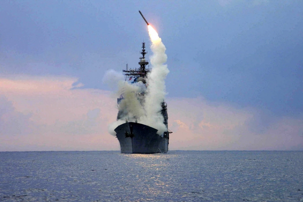 A Tomahawk missile is launched from a U.S. guided missile cruiser. A Tomahawk missile is launched from a U.S. guided missile cruiser.