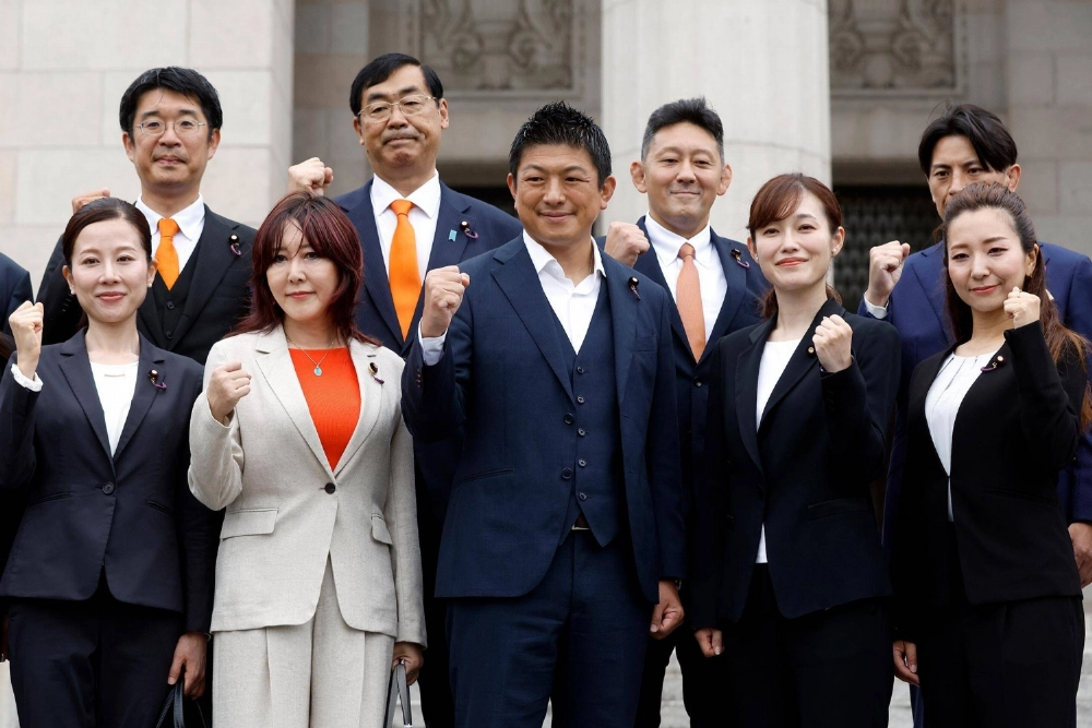 Sanseito leader Sohei Kamiya (center) with other parliament members from the party Sanseito leader Sohei Kamiya (center) with other parliament members from the party