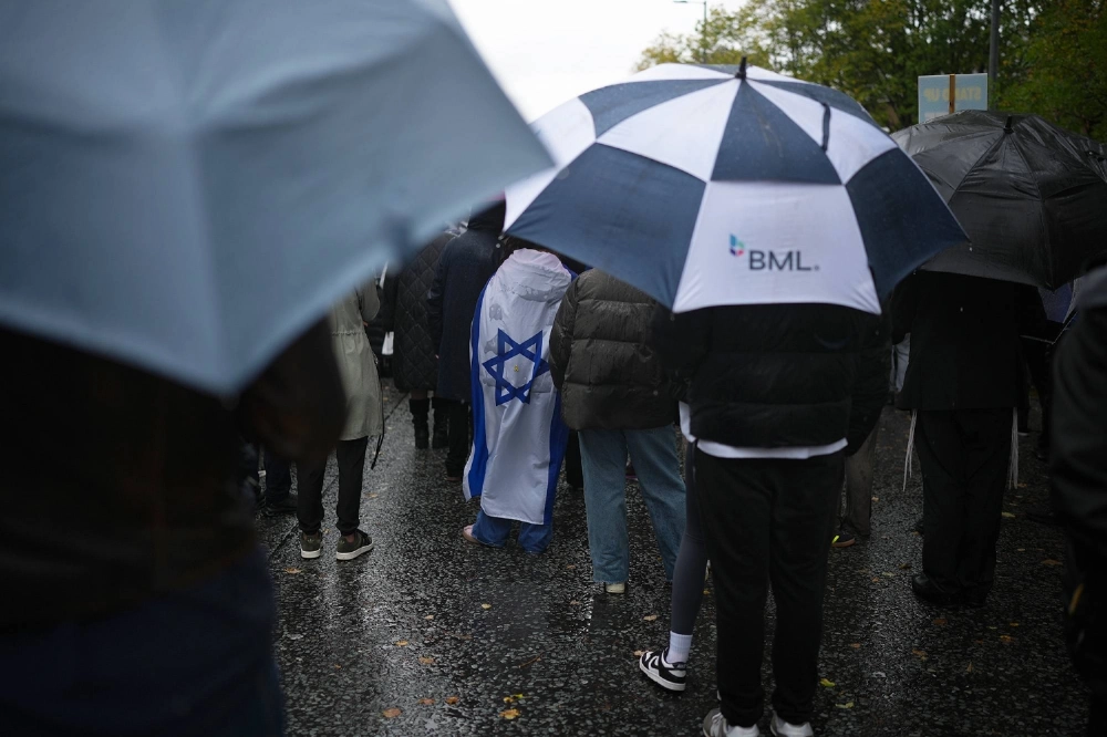 People attend a vigil to remember the victims of the Manchester Synagogue attack in Manchester, U.K. on Friday. People attend a vigil to remember the victims of the Manchester Synagogue attack in Manchester, U.K. on Friday.