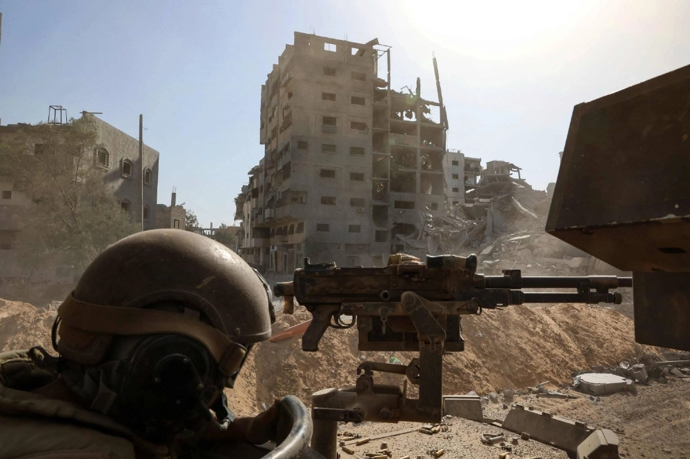 An Israeli Army soldier mans a mounted machine gun in the vicinity of the Jordanian Field Hospital in Gaza City, in the Gaza Strip, in this picture taken during a media tour organized by the Israeli Army on Friday.  An Israeli Army soldier mans a mounted machine gun in the vicinity of the Jordanian Field Hospital in Gaza City, in the Gaza Strip, in this picture taken during a media tour organized by the Israeli Army on Friday.