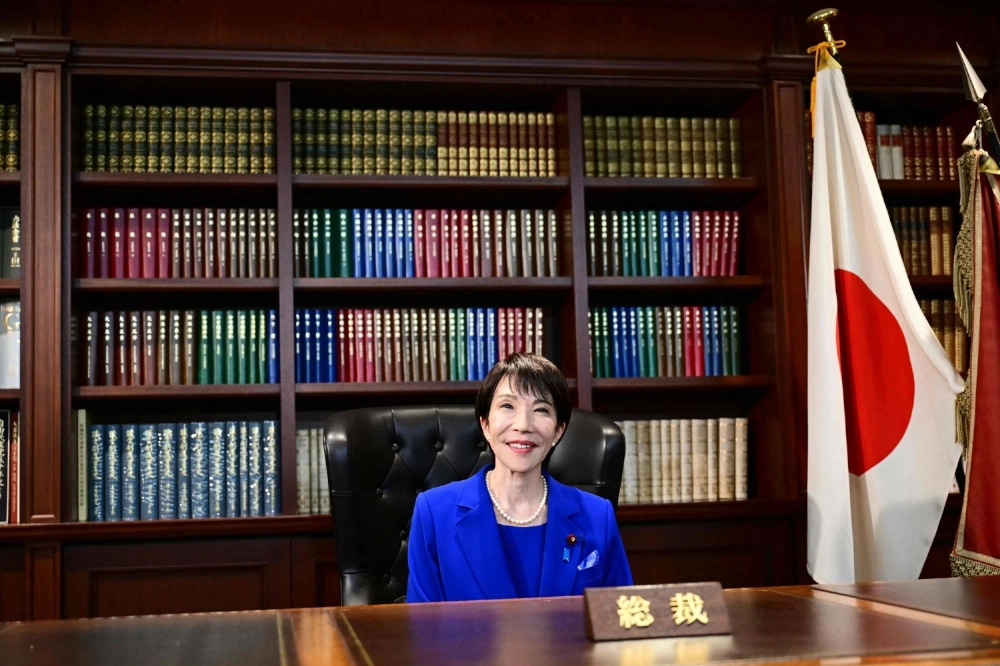 Sanae Takaichi, the newly elected leader of Japan's ruling Liberal Democratic Party, poses in the party leader's office after the LDP leadership election in Tokyo on Saturday. Sanae Takaichi, the newly elected leader of Japan's ruling Liberal Democratic Party, poses in the party leader's office after the LDP leadership election in Tokyo on Saturday.