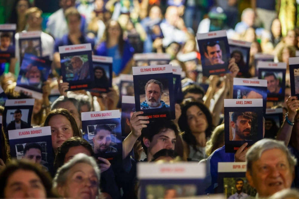 People attend a commemorative event organized by the Israeli community to honor the lives lost in the Hamas attack on Oct. 7, 2023, at the Hebraica Club in Sao Paulo, Brazil on Sunday. People attend a commemorative event organized by the Israeli community to honor the lives lost in the Hamas attack on Oct. 7, 2023, at the Hebraica Club in Sao Paulo, Brazil on Sunday.