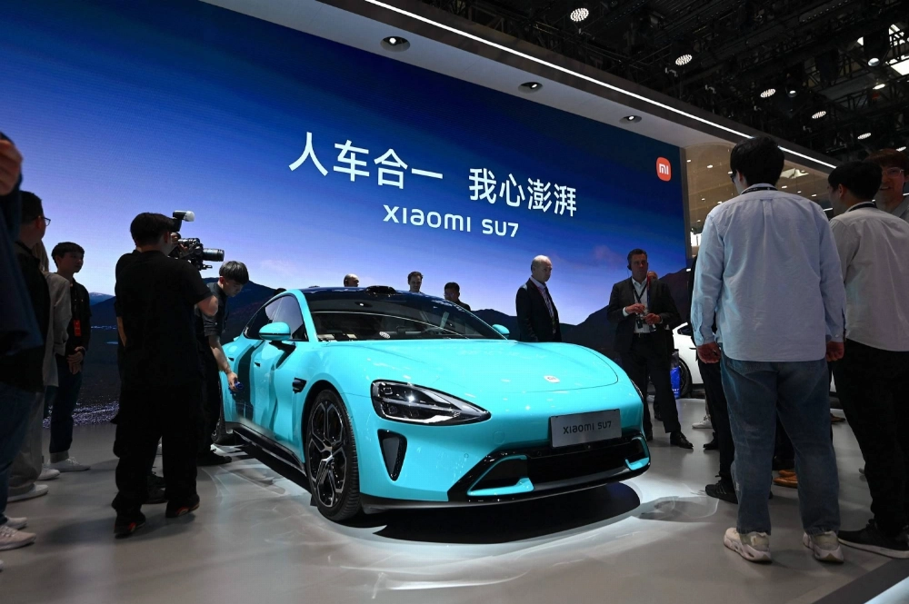 A Xiaomi SU7 model electric car is displayed at the Beijing Auto Show in Beijing in April last year. A Xiaomi SU7 model electric car is displayed at the Beijing Auto Show in Beijing in April last year.