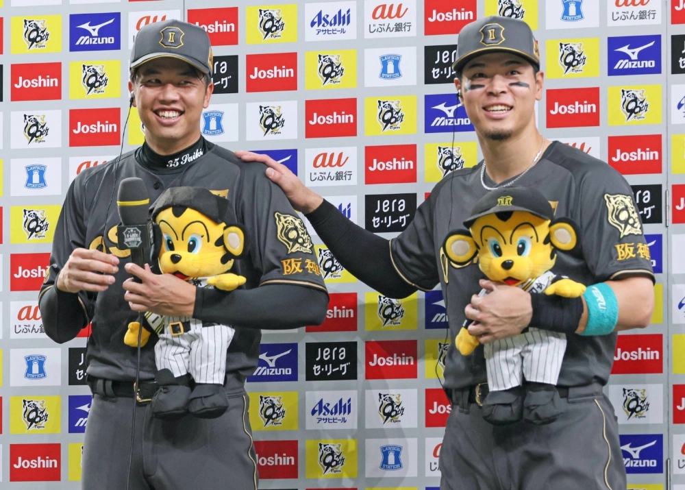 Hanshin pitcher Hiroto Saiki (left) and infielder Teruaki Sato were among the Central League title winners this season. Hanshin pitcher Hiroto Saiki (left) and infielder Teruaki Sato were among the Central League title winners this season.