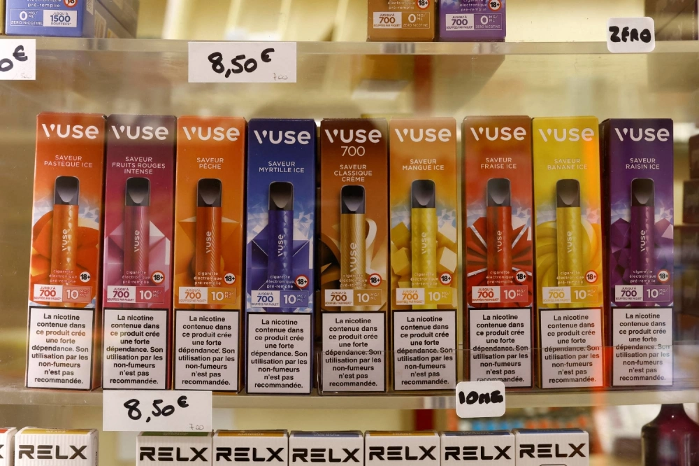 Boxes of single-use e-cigarettes are displayed for sale on shelves in a shop in Gardanne, France Boxes of single-use e-cigarettes are displayed for sale on shelves in a shop in Gardanne, France