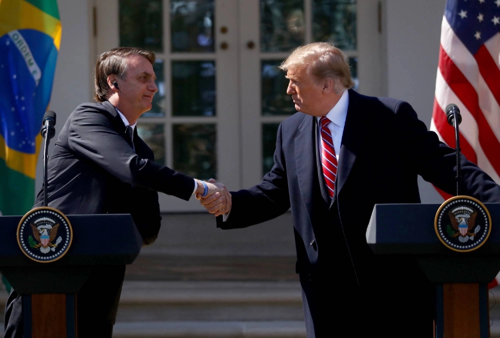 Former Brazilian President Jair Bolsonaro and U.S. President Donald Trump meet at the White House in 2019. Former Brazilian President Jair Bolsonaro and U.S. President Donald Trump meet at the White House in 2019.