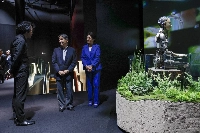 Emperor Naruhito and Empress Masako visit the Future of Life pavilion featuring androids and robots at the Osaka expo on Monday. | POOL / VIA JIJI