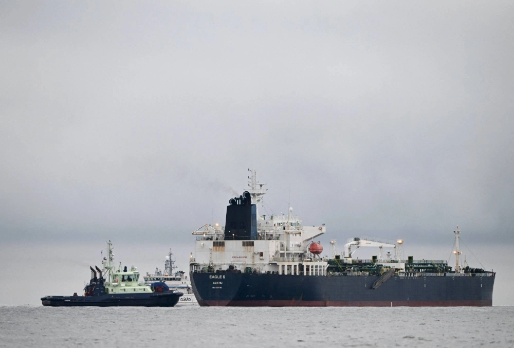 The oil tanker Eagle S sails alongside a Finnish border guard ship and tugboat in the Gulf of Finland on Dec. 28. The vessel was seized by Finland on suspicion of damaging underwater cables in the area at the time. The oil tanker Eagle S sails alongside a Finnish border guard ship and tugboat in the Gulf of Finland on Dec. 28. The vessel was seized by Finland on suspicion of damaging underwater cables in the area at the time.