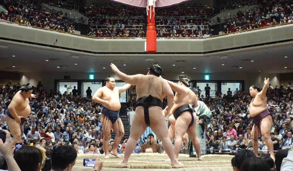 Top sumo stars, including yokozuna Hoshoryu, perform the goningakari contest, which pits five top-division wrestlers against one yokozuna.  Top sumo stars, including yokozuna Hoshoryu, perform the goningakari contest, which pits five top-division wrestlers against one yokozuna.