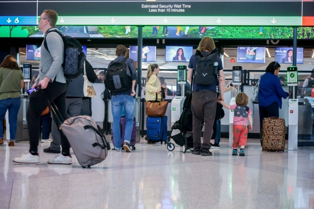 Travelers wait in line at a security checkpoint at Newark Liberty International Airport in Newark, New Jersey, on Monday. Travelers wait in line at a security checkpoint at Newark Liberty International Airport in Newark, New Jersey, on Monday.