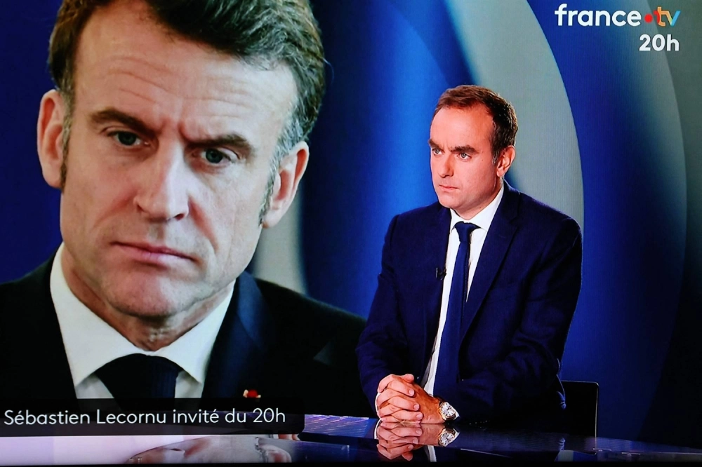 France's outgoing Prime Minister Sebastien Lecornu (right) with an image of French President Emmanuel Macron in the background during a live broadcast interview for French TV France 2 in Paris on Wednesday France's outgoing Prime Minister Sebastien Lecornu (right) with an image of French President Emmanuel Macron in the background during a live broadcast interview for French TV France 2 in Paris on Wednesday