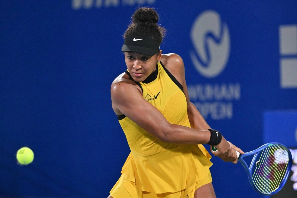 Naomi Osaka hits a return against Linda Noskova during their match at the Wuhan Open on Wednesday. Naomi Osaka hits a return against Linda Noskova during their match at the Wuhan Open on Wednesday.