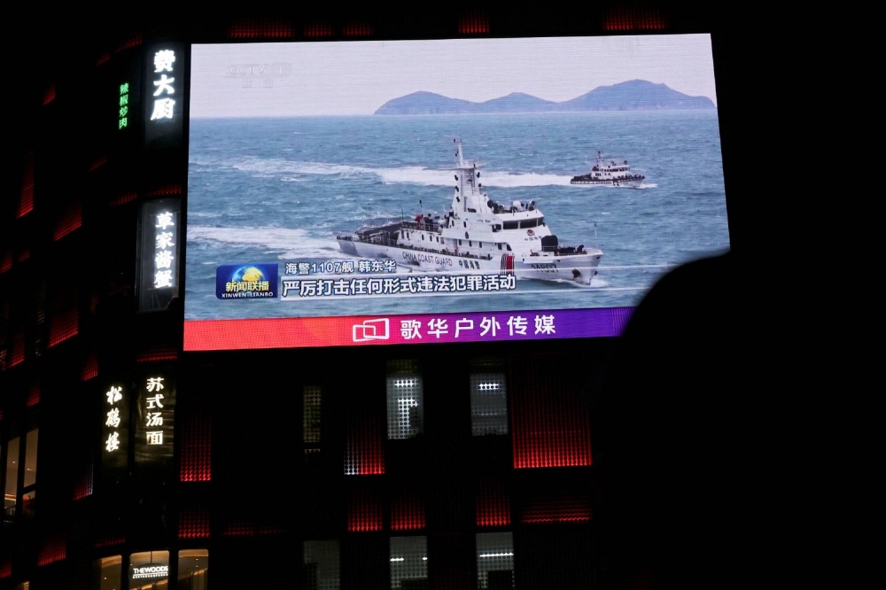 A China Coast Guard vessel is seen on a giant screen showing news footage about the coast guard's law enforcement patrols in waters around Taiwan, outside a shopping mall in Beijing on April 1. A China Coast Guard vessel is seen on a giant screen showing news footage about the coast guard's law enforcement patrols in waters around Taiwan, outside a shopping mall in Beijing on April 1.
