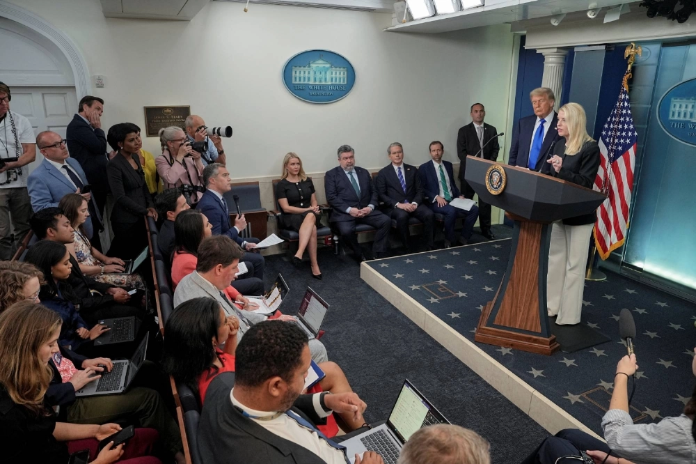 U.S. Attorney General Pam Bondi addresses the media at the White House on June 27 as President Trump listens following a Supreme Court ruling that limited federal judges' power to block presidential orders. U.S. Attorney General Pam Bondi addresses the media at the White House on June 27 as President Trump listens following a Supreme Court ruling that limited federal judges' power to block presidential orders.