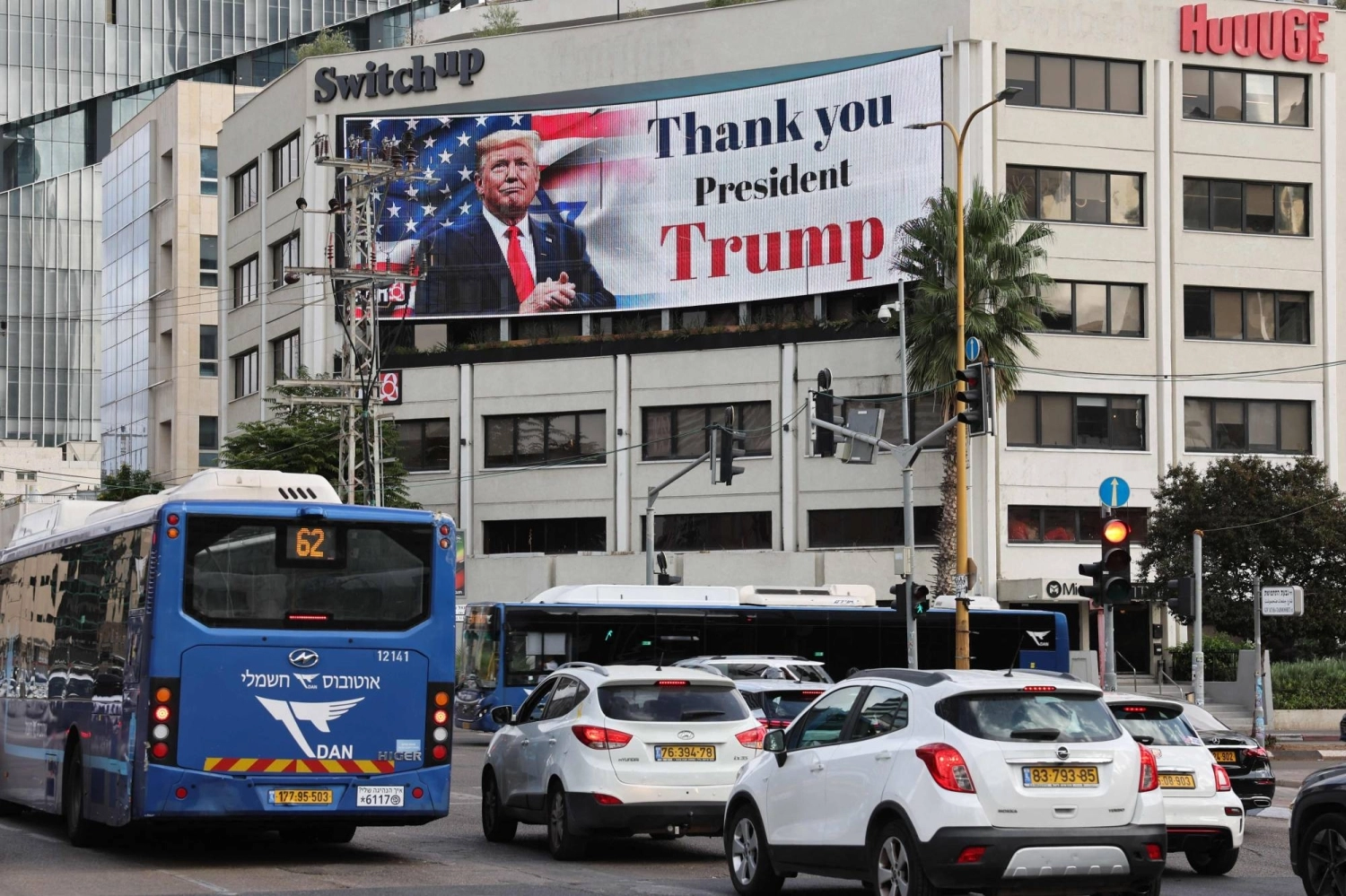 A billboard displays an image of U.S. President Donald Trump with a message thanking him for reaching a ceasefire deal in Gaza, on the side of a building in Tel Aviv's Hostage Square on Thursday. A billboard displays an image of U.S. President Donald Trump with a message thanking him for reaching a ceasefire deal in Gaza, on the side of a building in Tel Aviv's Hostage Square on Thursday.