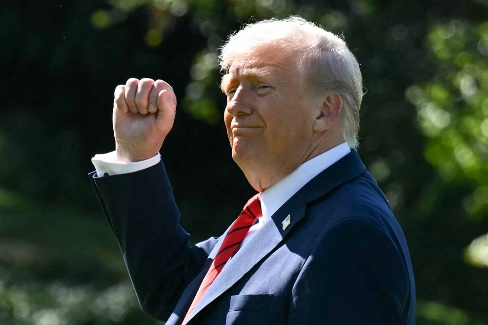 U.S. President Donald Trump gestures as he walks to Marine One on the South Lawn of the White House in Washington on Friday. U.S. President Donald Trump gestures as he walks to Marine One on the South Lawn of the White House in Washington on Friday.