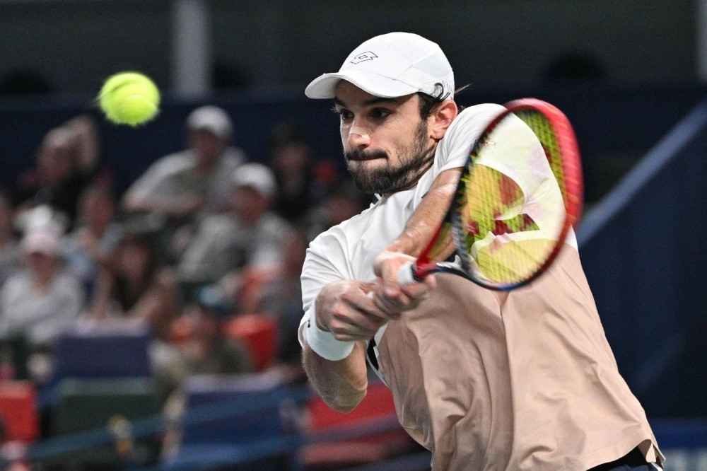 Valentin Vacherot hits a return to Arthur Rinderknech during the men's singles final at the Shanghai Masters tennis tournament in Shanghai on Sunday. Valentin Vacherot hits a return to Arthur Rinderknech during the men's singles final at the Shanghai Masters tennis tournament in Shanghai on Sunday.