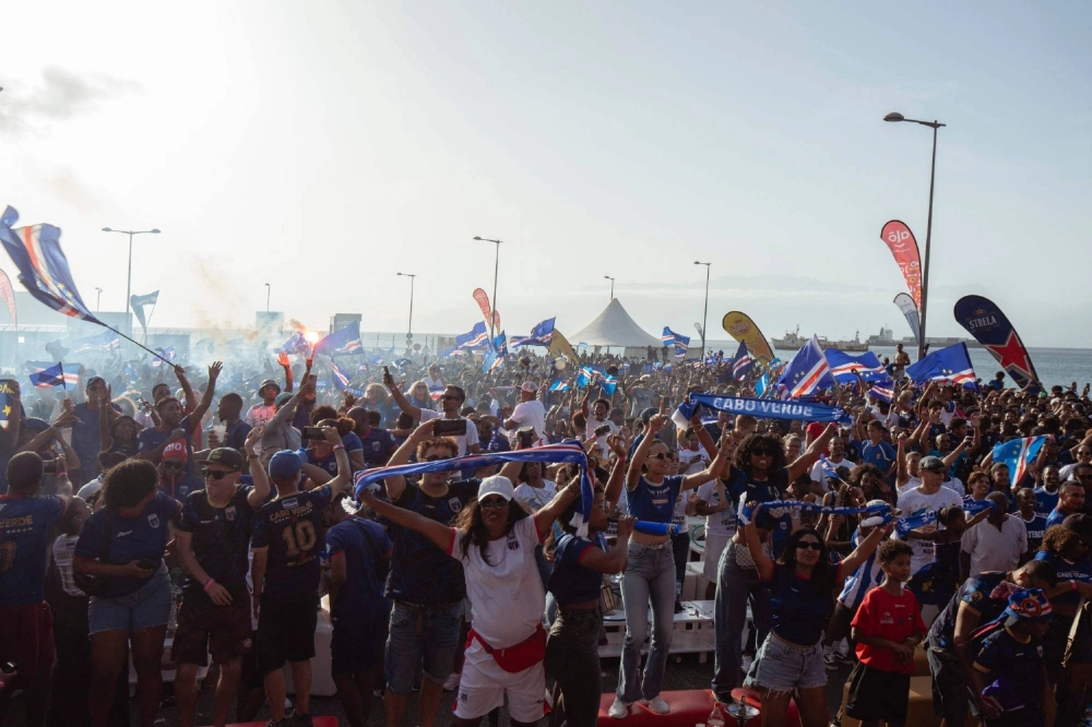 Supporters celebrate Cape Verde's victory against Eswatini in a 2026 World Cup qualifying match, at a fan zone in Sao Vicente, Cape Verde, on Monday.