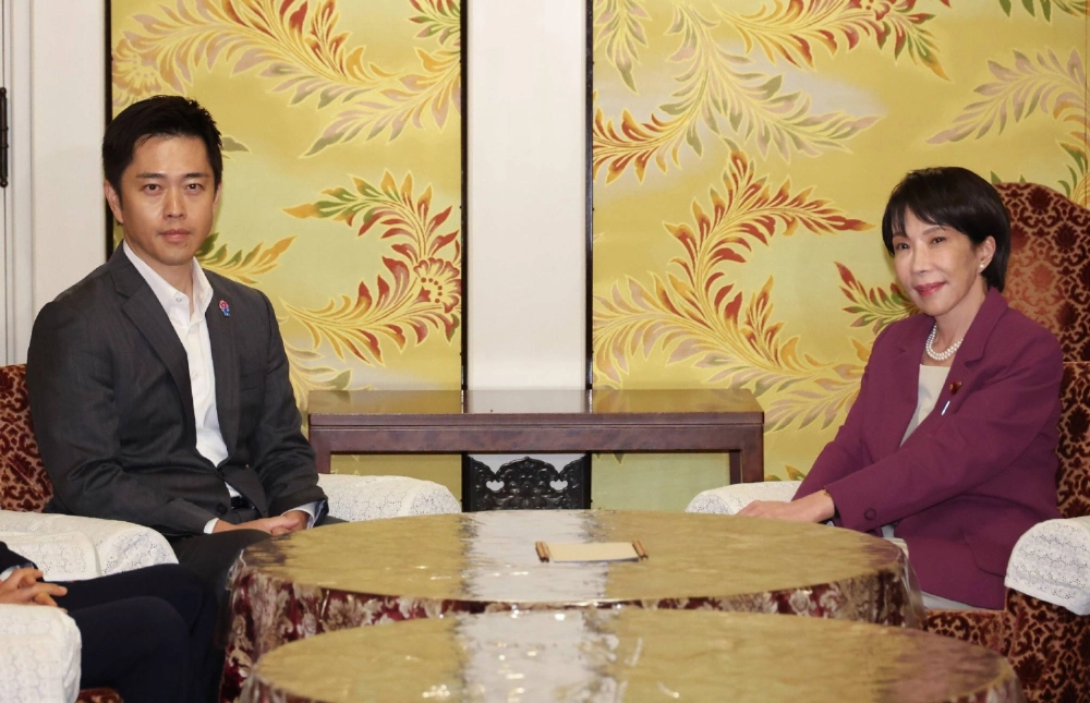 Nippon Ishin no Kai leader and Osaka Gov. Hirofumi Yoshimura meets with Liberal Democratic Party President Sanae Takaichi in Tokyo on Wednesday. Nippon Ishin no Kai leader and Osaka Gov. Hirofumi Yoshimura meets with Liberal Democratic Party President Sanae Takaichi in Tokyo on Wednesday.