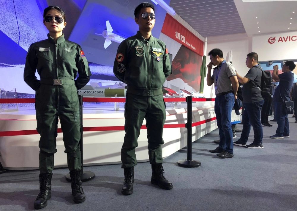 Visitors look at airborne weapons displayed at a booth of Aviation Industry Corporation of China at the China International Aviation and Aerospace Exhibition, or Zhuhai Airshow, in Zhuhai, China, in November 2018. Visitors look at airborne weapons displayed at a booth of Aviation Industry Corporation of China at the China International Aviation and Aerospace Exhibition, or Zhuhai Airshow, in Zhuhai, China, in November 2018.