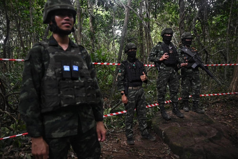 Royal Thai soldiers stand guard at an area along the Thai-Cambodian border in August.  Royal Thai soldiers stand guard at an area along the Thai-Cambodian border in August.