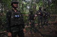 Royal Thai soldiers stand guard at an area along the Thai-Cambodian border in August.  | AFP-JIJI / VIA GETTY IMAGES