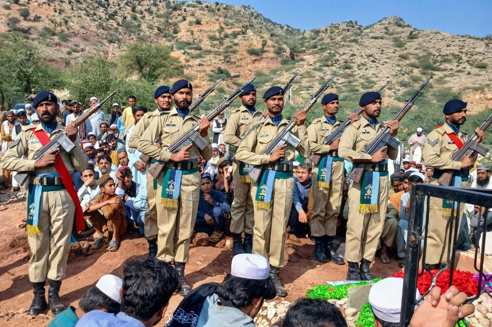 Pakistan Army's ceremonial guards perform during the funeral ceremony of a paramilitary personnel of the Frontier Corps (FC) who was killed during the Afghanistan-Pakistan border clashes, in Kohat, Pakistan, on Friday.  Pakistan Army's ceremonial guards perform during the funeral ceremony of a paramilitary personnel of the Frontier Corps (FC) who was killed during the Afghanistan-Pakistan border clashes, in Kohat, Pakistan, on Friday.