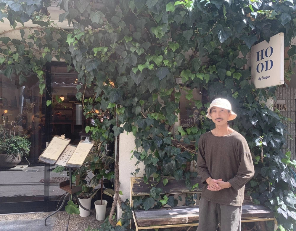 Shunsuke Takahashi, owner of the cafe Hood by Vargas, says the Osaka neighborhood of Nakatsu feels brighter and calmer with the influx of new businesses. Shunsuke Takahashi, owner of the cafe Hood by Vargas, says the Osaka neighborhood of Nakatsu feels brighter and calmer with the influx of new businesses.