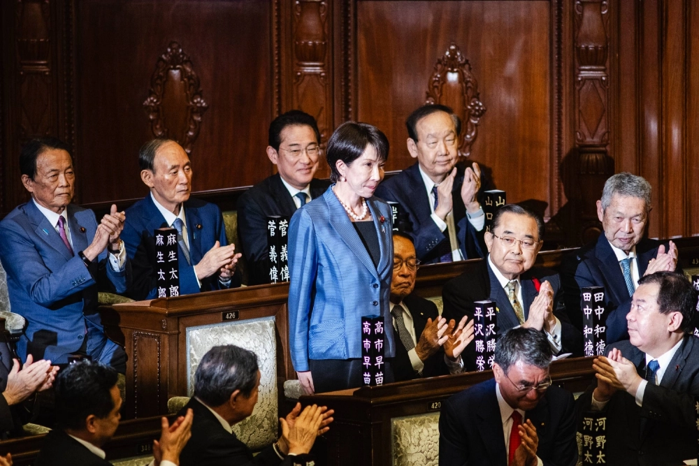 Liberal Democratic Party President Sanae Takaichi reacts to applauding lawmakers after being elected prime minister at the Lower House on Tuesday. Liberal Democratic Party President Sanae Takaichi reacts to applauding lawmakers after being elected prime minister at the Lower House on Tuesday.