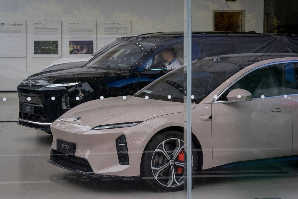 NIO electric vehicles on display at a showroom in Beijing on Oct. 18. China's auto market is still proving irresistible for new entrants, despite the challenges of turning a profit. NIO electric vehicles on display at a showroom in Beijing on Oct. 18. China's auto market is still proving irresistible for new entrants, despite the challenges of turning a profit.