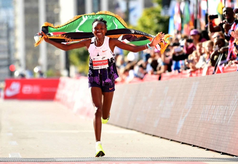Ruth Chepngetich celebrates after finishing first in the women’s race, setting a world record at 2:09:56 during the Chicago Marathon at Grant Park on Oct. 13, 2024. Ruth Chepngetich celebrates after finishing first in the women’s race, setting a world record at 2:09:56 during the Chicago Marathon at Grant Park on Oct. 13, 2024.