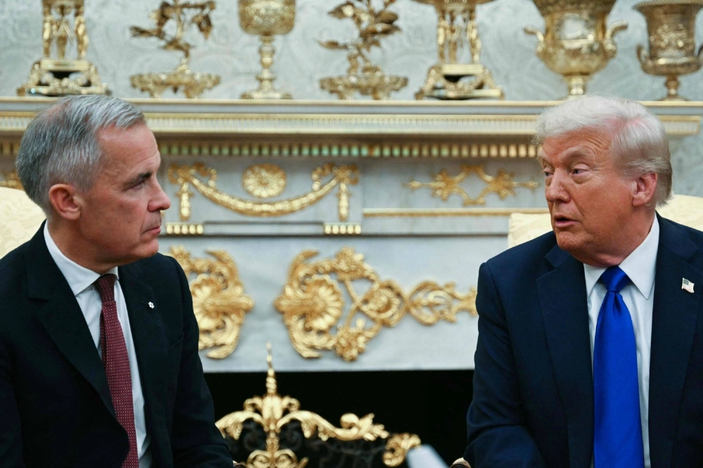 U.S. President Donald Trump meets with Canadian Prime Minister Mark Carney in the Oval Office of the White House in Washington on Oct. 7. U.S. President Donald Trump meets with Canadian Prime Minister Mark Carney in the Oval Office of the White House in Washington on Oct. 7.