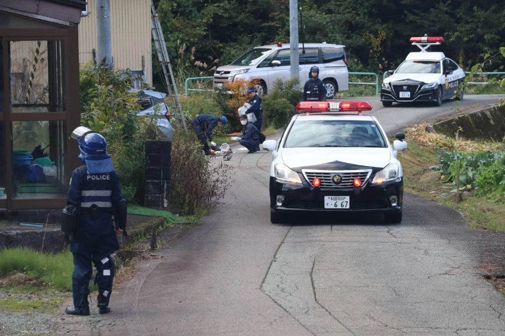 Police investigate at the scene of a bear attack that killed one person and injured three others on Friday in the village of Higashinaruse in Akita Prefecture. Police investigate at the scene of a bear attack that killed one person and injured three others on Friday in the village of Higashinaruse in Akita Prefecture.