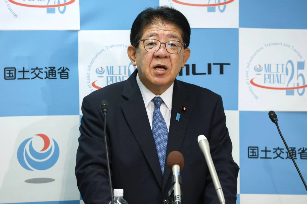 Tourism minister Yasushi Kaneko holds a news conference in Tokyo on Wednesday. Tourism minister Yasushi Kaneko holds a news conference in Tokyo on Wednesday.