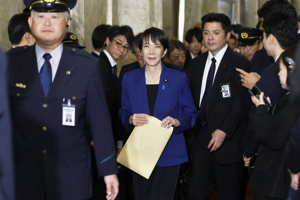 Prime Minister Sanae Takaichi arrives for an extraordinary session of parliament in Tokyo on Friday. Prime Minister Sanae Takaichi arrives for an extraordinary session of parliament in Tokyo on Friday.