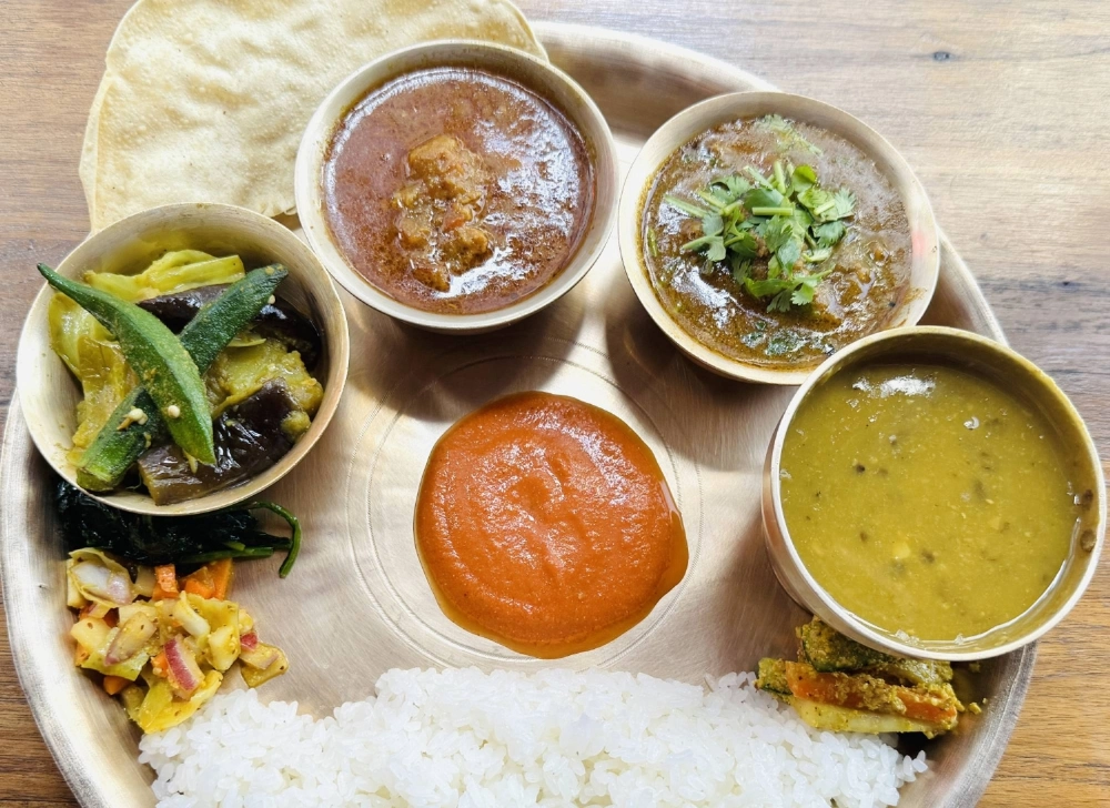 At Nepalico, the "dal bhat" — a Nepali dish consisting of rice and lentils stewed with spices — with chicken curry is the most popular item on the menu. At Nepalico, the "dal bhat" — a Nepali dish consisting of rice and lentils stewed with spices — with chicken curry is the most popular item on the menu.