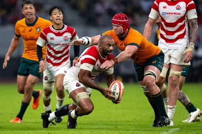 Japan's Michael Leitch controls the ball during the match against Australia on Saturday.  Japan's Michael Leitch controls the ball during the match against Australia on Saturday.