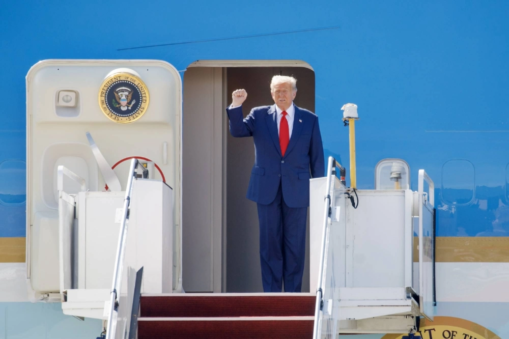 U.S. President Donald Trump disembarks Air Force One at Kuala Lumpur International Airport in Sepang, Selangor, Malaysia, on Sunday. U.S. President Donald Trump disembarks Air Force One at Kuala Lumpur International Airport in Sepang, Selangor, Malaysia, on Sunday.